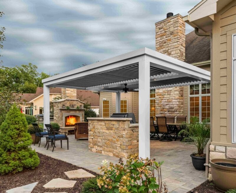 louvered pergola - grandseabuilding.com An outdoor living room with a pergola, comfy furniture, and a firepit
