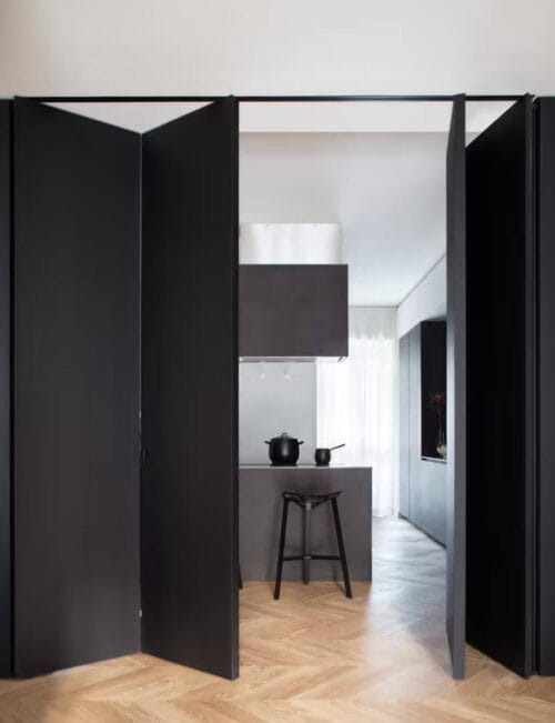 A stylish kitchen with a concealed pantry door - grandseabuilding.com