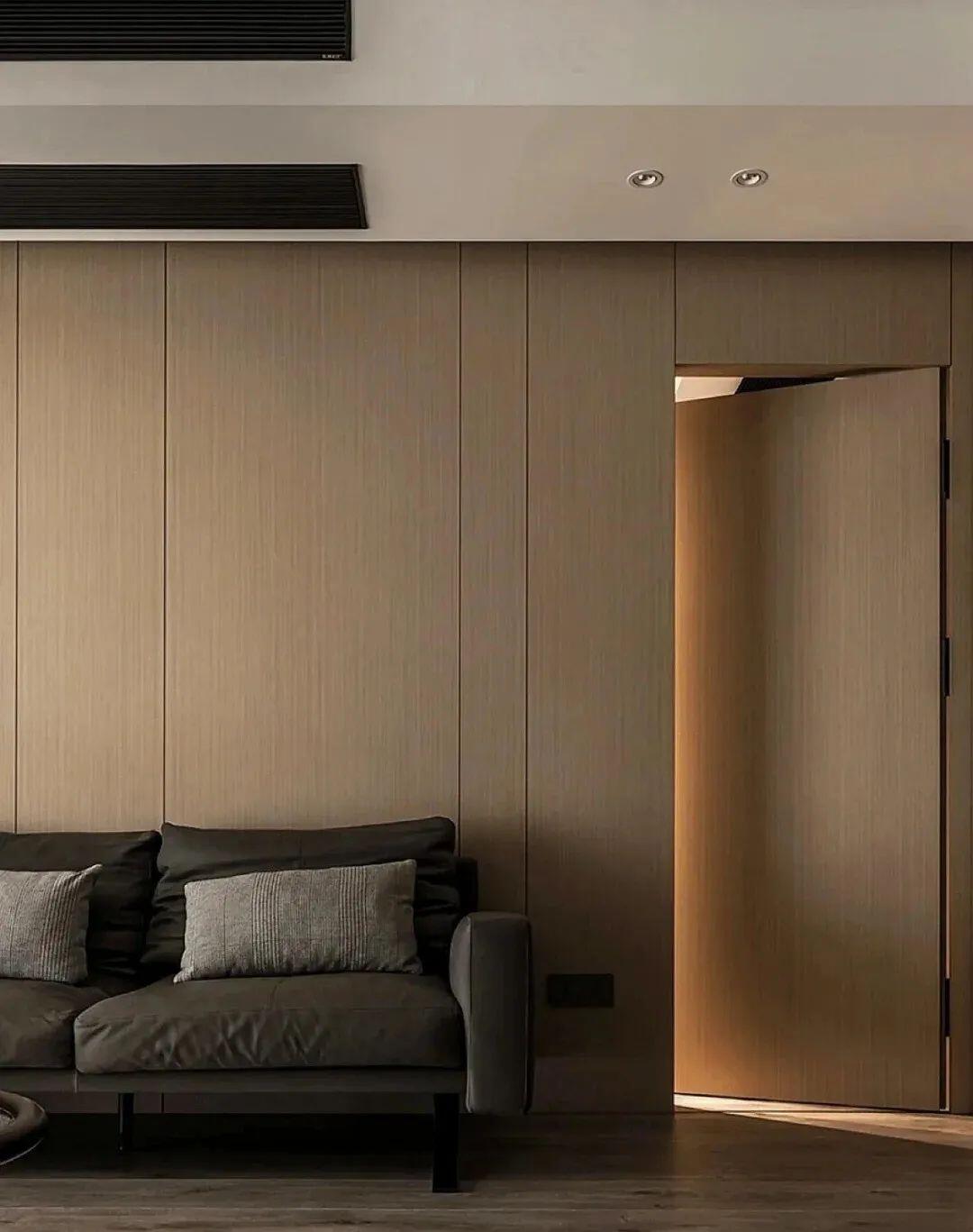 hidden door in living room - grandseabuilding.com