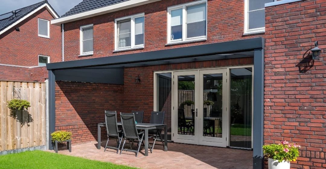A aluminum pergola connected to a brick house - grandseabuilding.com