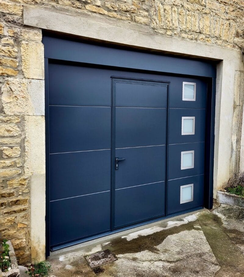 a designer garage door with a pedestrian entry and stylish windows - grandseabuilding.com