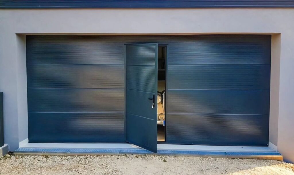 a large garage with an single integrated pedestrian door - grandseabuilding.com