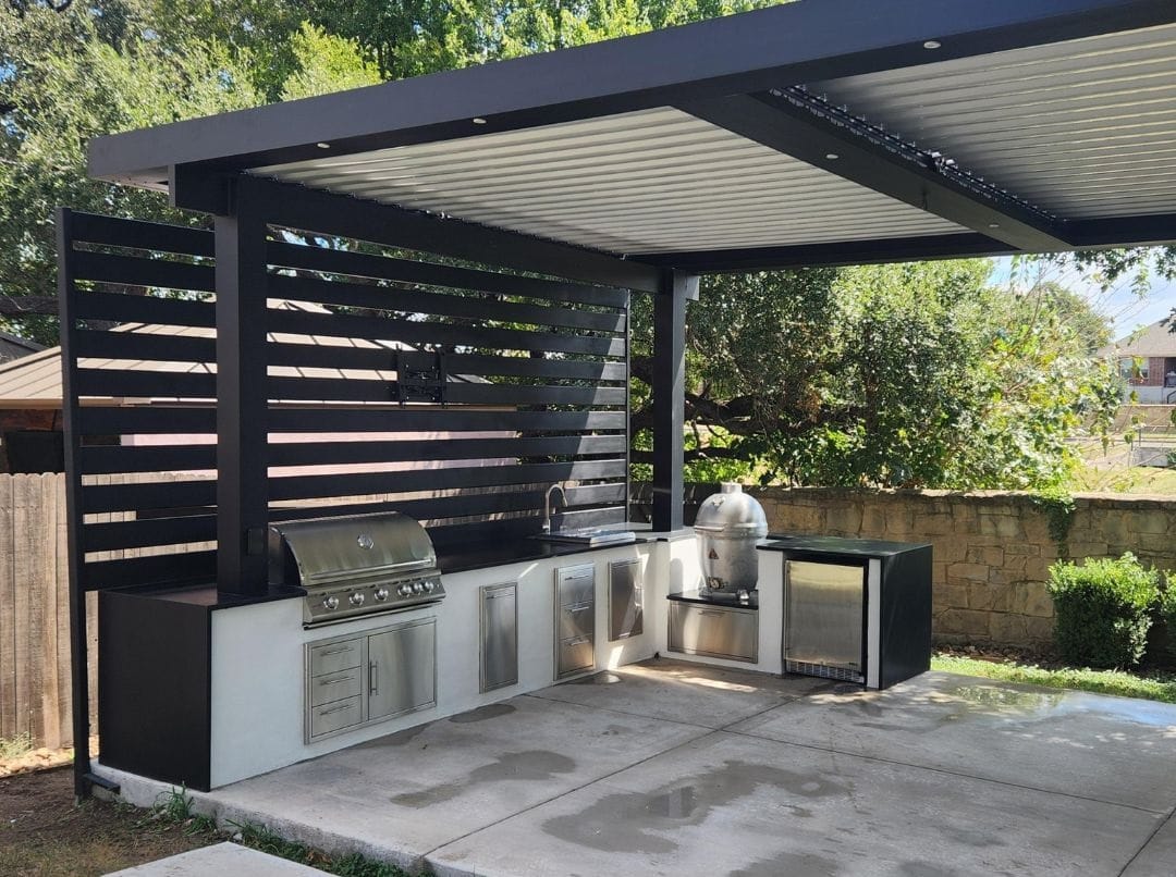 An outdoor freestanding pergola with stainless steel kitchen cabinets and privacy wall - grandseabuilding.com