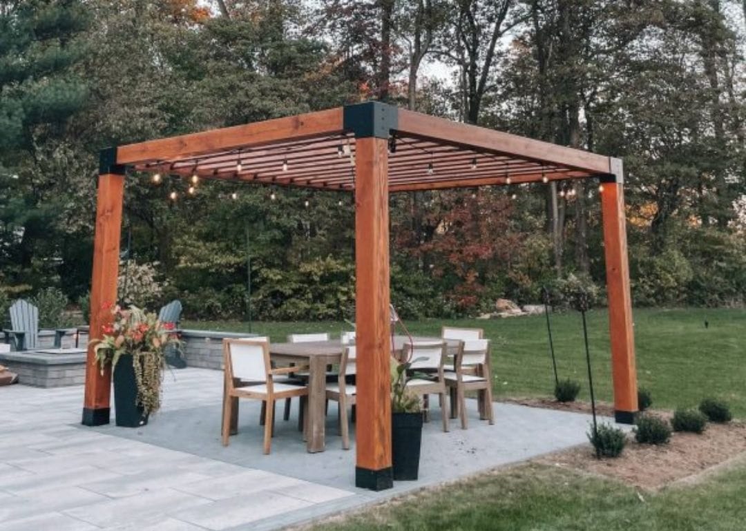 a modern pergola with sleek metal brackets - grandseabuilding.com