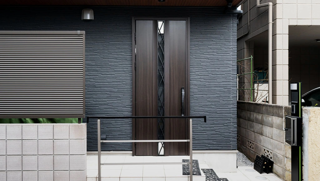 Modern pivot front door with sleek dark wood finish and glass panel design